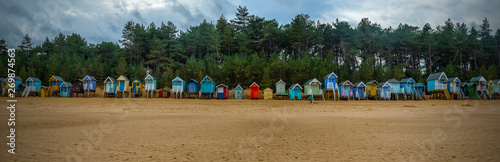 Beach huts in well next to the sea photo