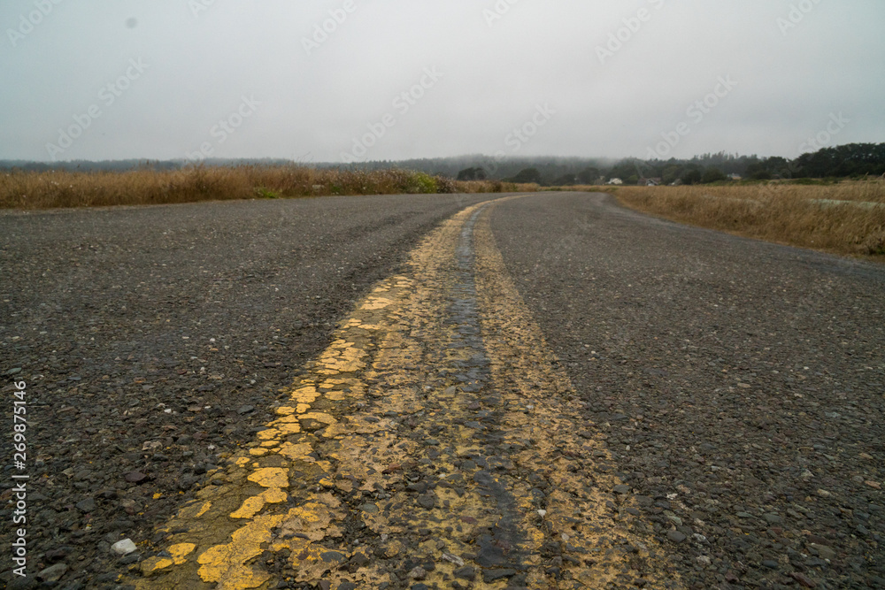 Naklejka premium Old paved road into the distance.