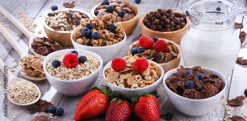 Bowls with different sorts of breakfast cereal products photo