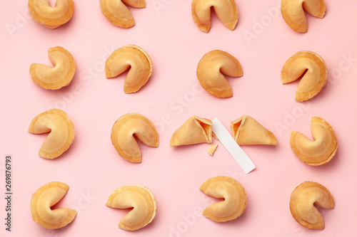 Chinese fortune cookies. Cookies texture pattern with empty blank inside for word prediction. Pink background.