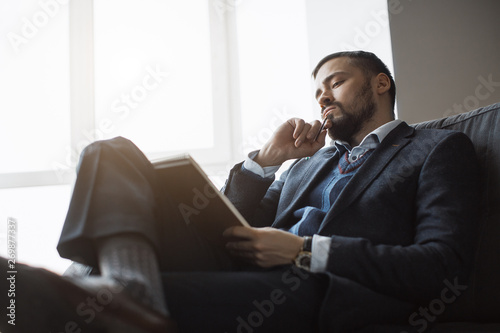 Man Working In Office Doing Notes