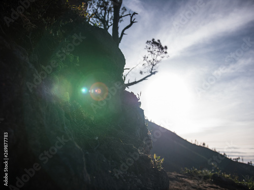 Lens flare from the sun during a mountain trek  (ID: 269877783)