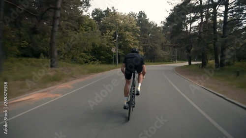 Wallpaper Mural Cyclist Cycling On Road Bicycle Before Triathlon.Bicycle Wheel Close Up.Triathlete Twists Pedals On Bike.Gear System Road Bicycle.Athlete Cyclist Riding On Carbon Bicycle.Cyclists Riding At Sunset.	 Torontodigital.ca