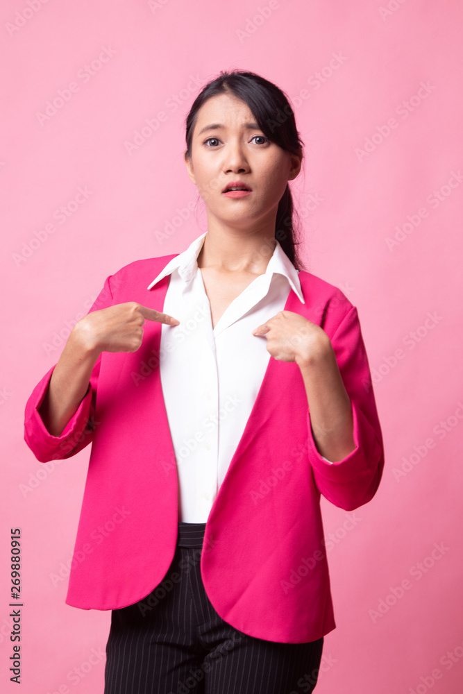 Young Asian woman point at herself ask why me. Young Asian woman point at herself ask why me.