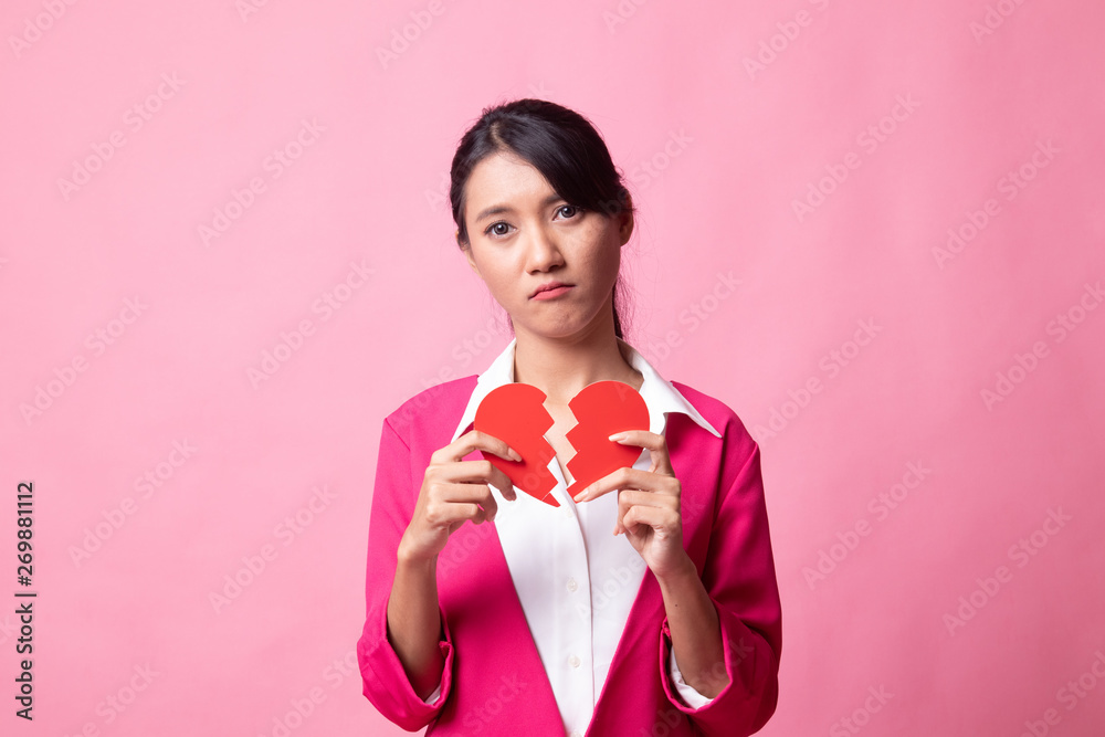 Beautiful young Asian woman with broken heart. Beautiful young Asian woman with broken heart.