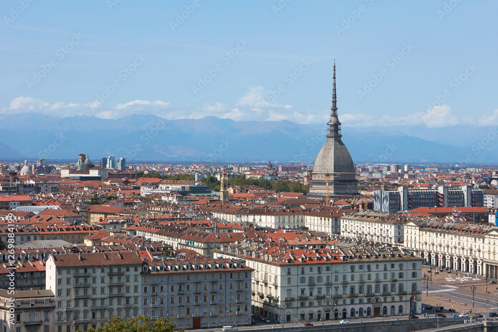 Obraz premium Turin rooftops, Mole Antonelliana tower and mountains in a sunny summer day in Italy