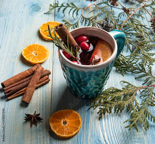 Fototapeta Naklejka Na Ścianę i Meble -  red wine christmas blue background orange cinnamon.