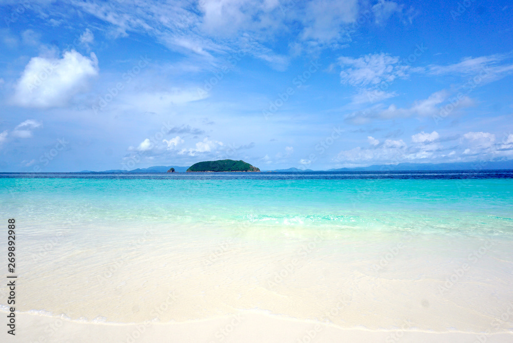 White sand beach with beautiful clean and clear sea water on sunny day White sand beach with beautiful clean and clear sea water on sunny day