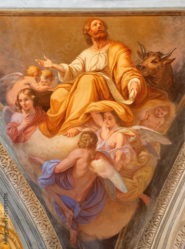 COMO, ITALY - MAY 8, 2015: The fresco of St. Luke the evangelist in church Basilica di San Fedele by Giovanni Valtorta  (1846).