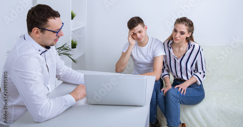 Young couple at psychologist cabinet. Sad male patient talking about his problems. Young female patient © burdun