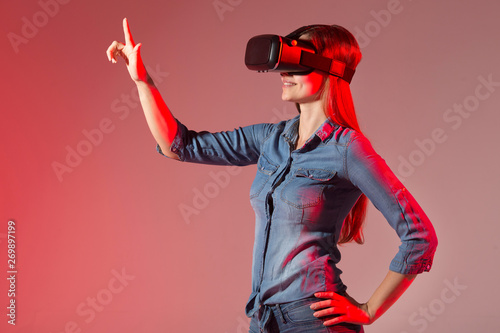 beautiful young woman wearing virtual reality glasses © Alexandr