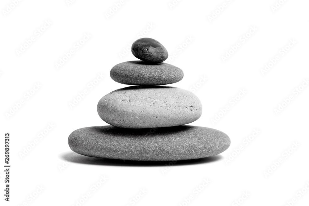 Stacked smooth grey stones. Sea pebble. Balancing pebbles isolated on white background Stacked smooth grey stones. Sea pebble. Balancing pebbles isolated on white background