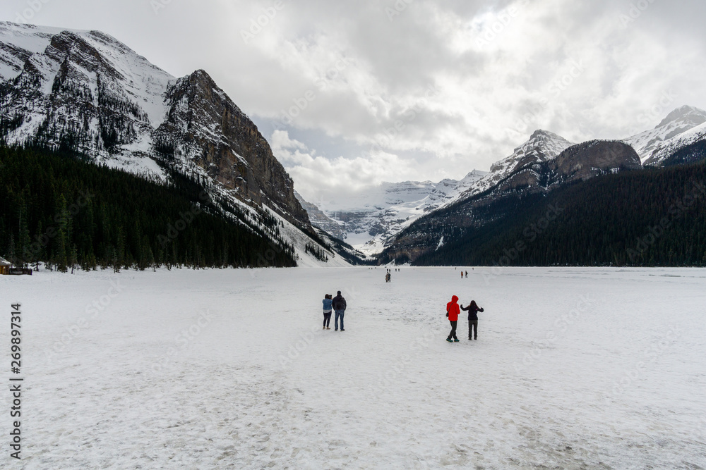 People Walking on Frozen Lake Louise