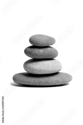 Stacked smooth grey stones. Sea pebble. Balancing pebbles isolated on white background