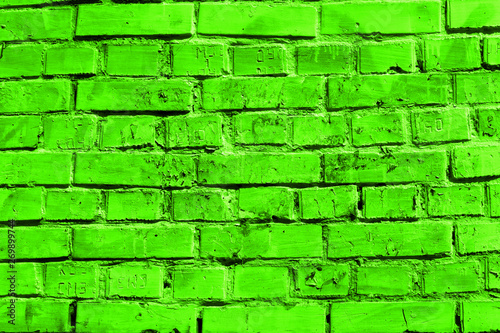 Old green whitewashed brick wall.