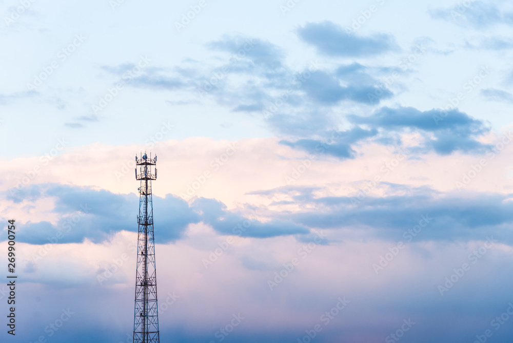 Abstract telecommunication tower Antenna and satellite dish at sunset sky clouds backgrounds.
