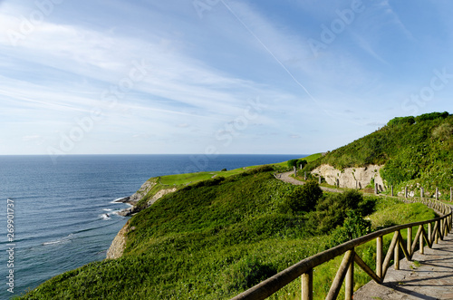 Landscape of a footpath by the coast in a sunny day.