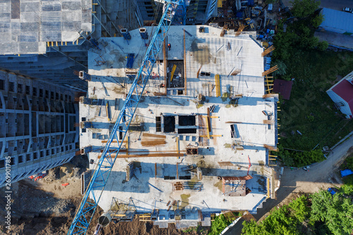 Aerial view of construction site of new modern apartment residential building, drone photo, top view © DedMityay