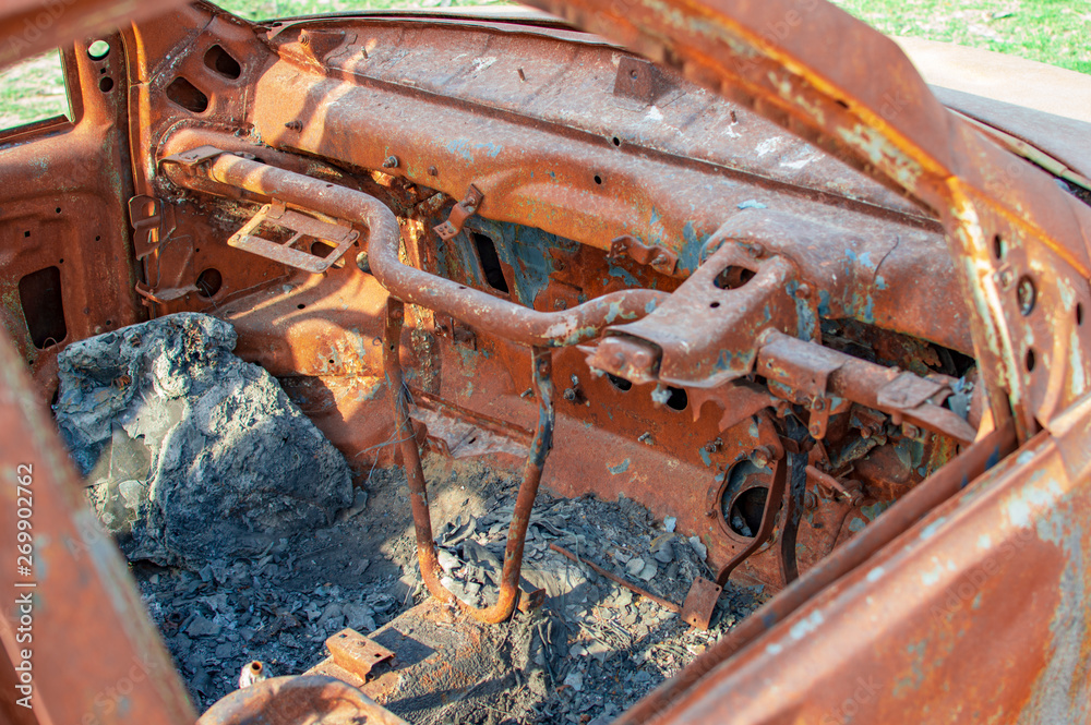 Burned car with burnt dash and wheel Burned car with burnt dash and wheel