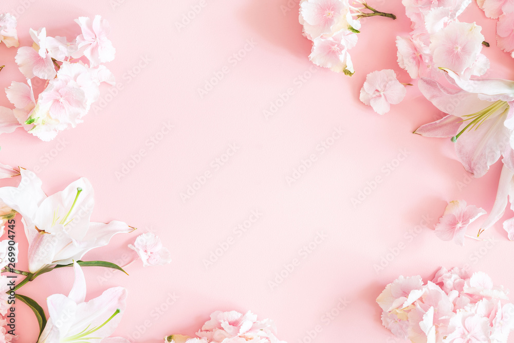 Flowers composition. Pink and white flowers on pastel pink background. Flat lay, top view, copy space
