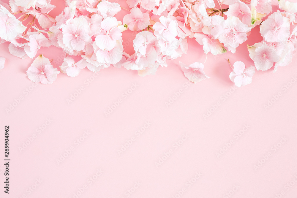 Flowers composition. Hydrangea flowers on pastel pink background. Flat lay, top view, copy space