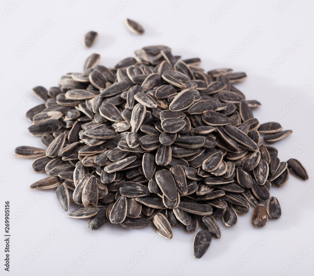 Sunflower seeds on a white surface