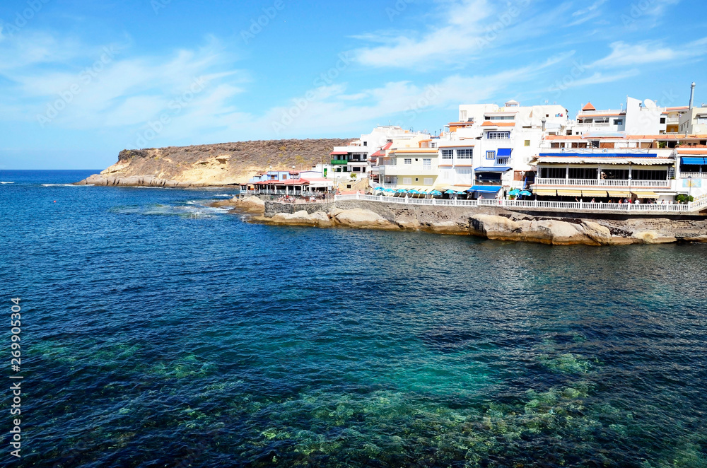 Beautiful coastal view of La Caleta fishing village in Tenerife,Canary Islands,Spain.Summer vacation or travel concept.Selective focus.