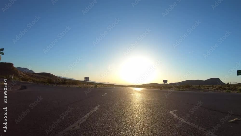 Nevada Highway 159 sunrise rear view driving time lapse at Red Rock Canyon National Conservation Area near Las Vegas. Nevada Highway 159 sunrise rear view driving time lapse at Red Rock Canyon National Conservation Area near Las Vegas.