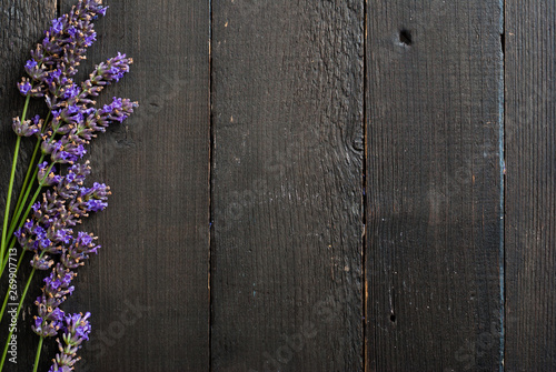 purple lavender flowers on black wooden table background
