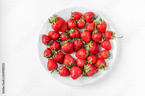 plate with strawberries on a white background