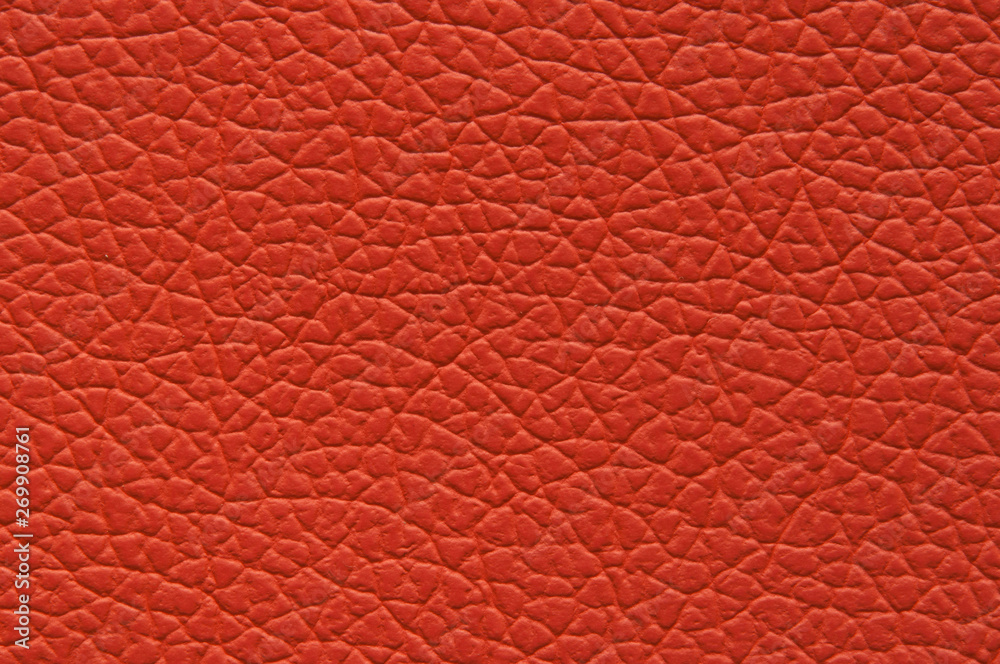 Highly saturated orange orange artificial leather with large texture. Highly saturated orange orange artificial leather with large texture.