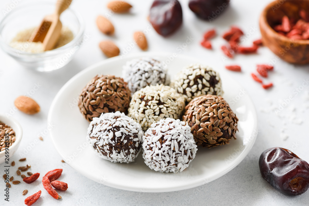 Healthy vegan protein energy balls with nuts, seeds and dried fruits. Homemade raw chocolate truffles Healthy vegan protein energy balls with nuts, seeds and dried fruits. Homemade raw chocolate truffles