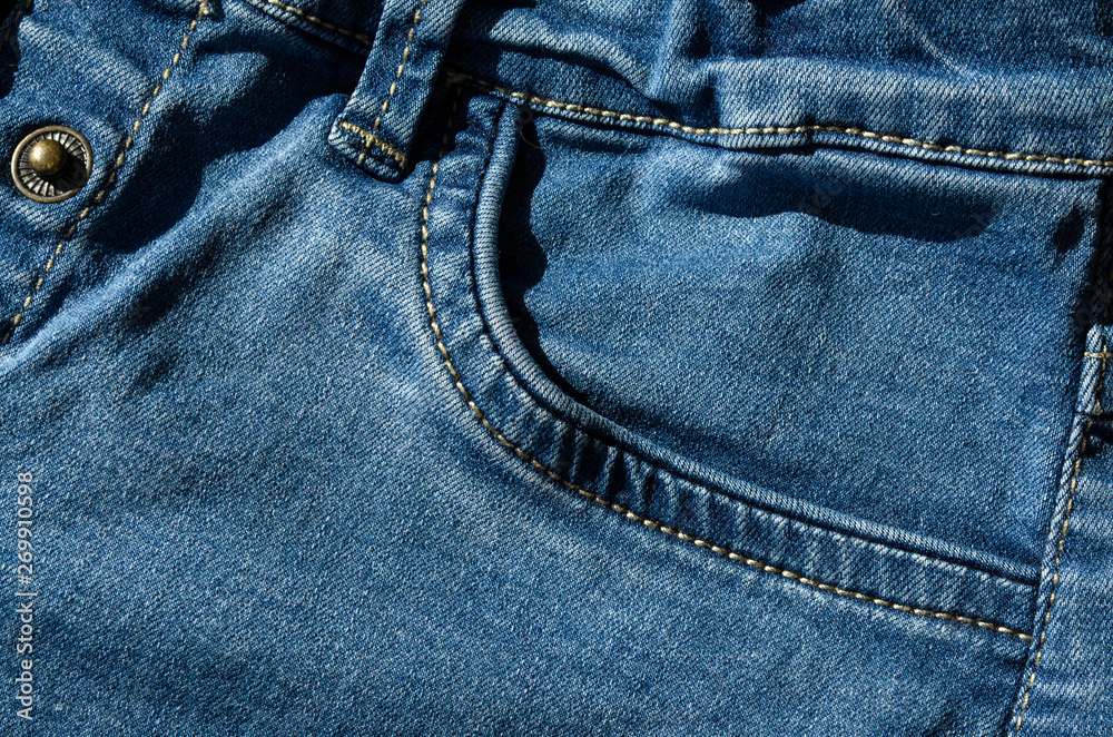 Closeup of blue jeans pocket Closeup of blue jeans pocket