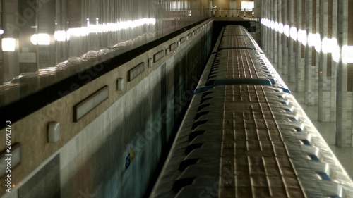 Metro train moving in tunnel, top view. Underground train arriving at subway station, view from above.