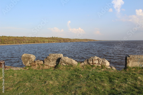 White lake with beach and forest pier