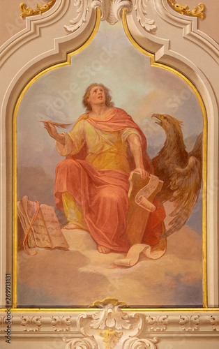MENAGGIO, ITALY - MAY 8, 2015: The neobaroque fresco of St. John the Evangelist in church chiesa di Santo Stefano by Luigi Tagliaferri (1841-1927).