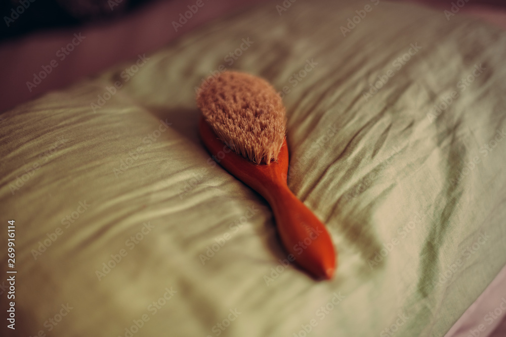 Foto de Hairbrush for spanking on pillow. Domestic discipline