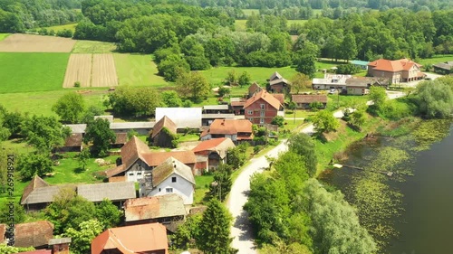 Rural Croatia, beautiful countryside landscape in nature park Lonjsko polje from air, panoramic view of traditional village Muzilovcica  photo