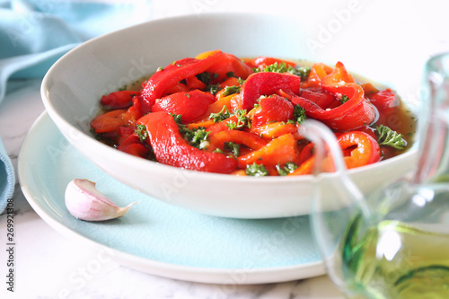 Escalivada. Vegetable salad: roasted bell pepper, parsley, garlic and olive oil photo