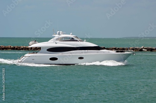 White motor yacht on Government Cut inlet off Miami Beach,Florida headed towards the Port of Miami. © Wimbledon