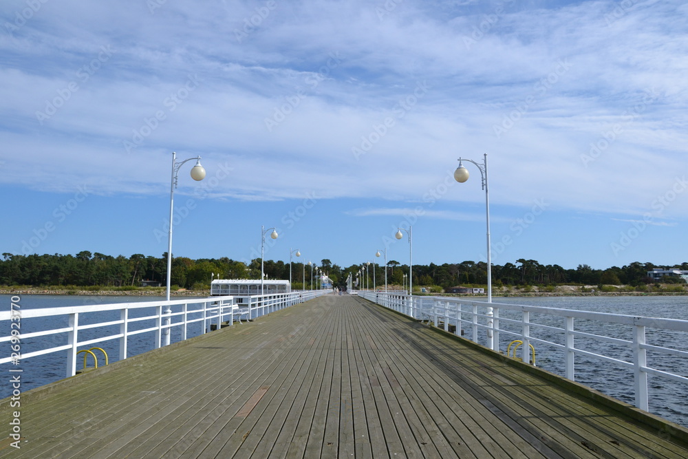  Wooden pier in Jurata town at sunny, summer day. Coast of Baltic Sea at Hel peninsula, Poland 