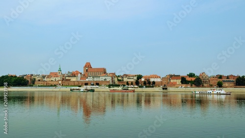 Panoramic view od old town in Torun, Poland, on Vistula bank. Historical district of Torun old town by the Vistula river