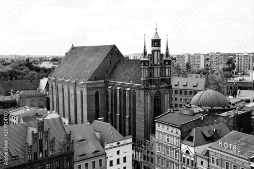Gothic Cathedral of St. John the Baptist and St. John the Evangelist. Aerial view of a historical old town in Torun, on Vistula bank, Poland. Black and white.