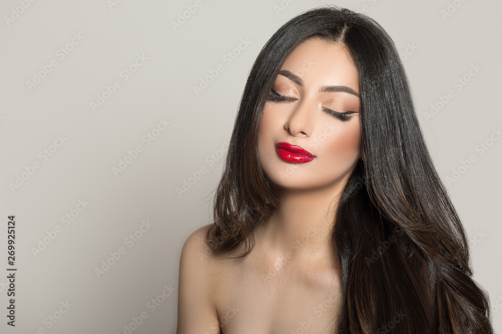 Woman with red lipstick and dark thick hair. Eyes closed Woman with red lipstick and dark thick hair. Eyes closed