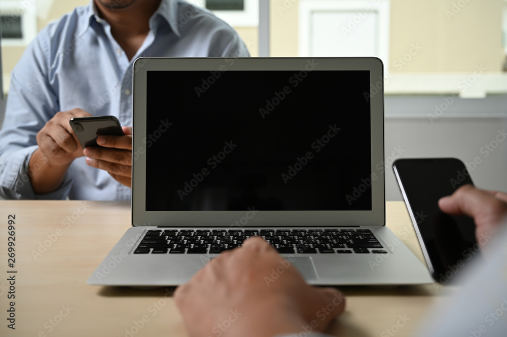 Mockup image of business Laptop with blank screen on table blank copy space screen for your advertising text message Mockup image of business Laptop with blank screen on table blank copy space screen for your advertising text message