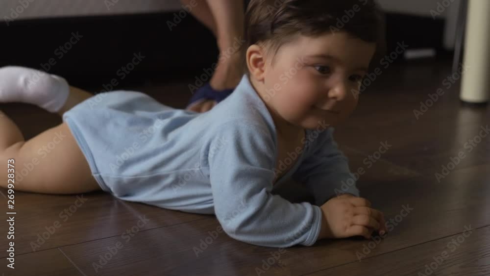 Mother playing with teddy bear and her baby son indoor flat - Asian mixed ethnicity child Boy wearing blue body shirt with smiling bear cartoon Pregnant Mother playing with teddy bear and her baby son indoor flat - Asian mixed ethnicity child Boy wearing blue body shirt with smiling bear cartoon Pregnant