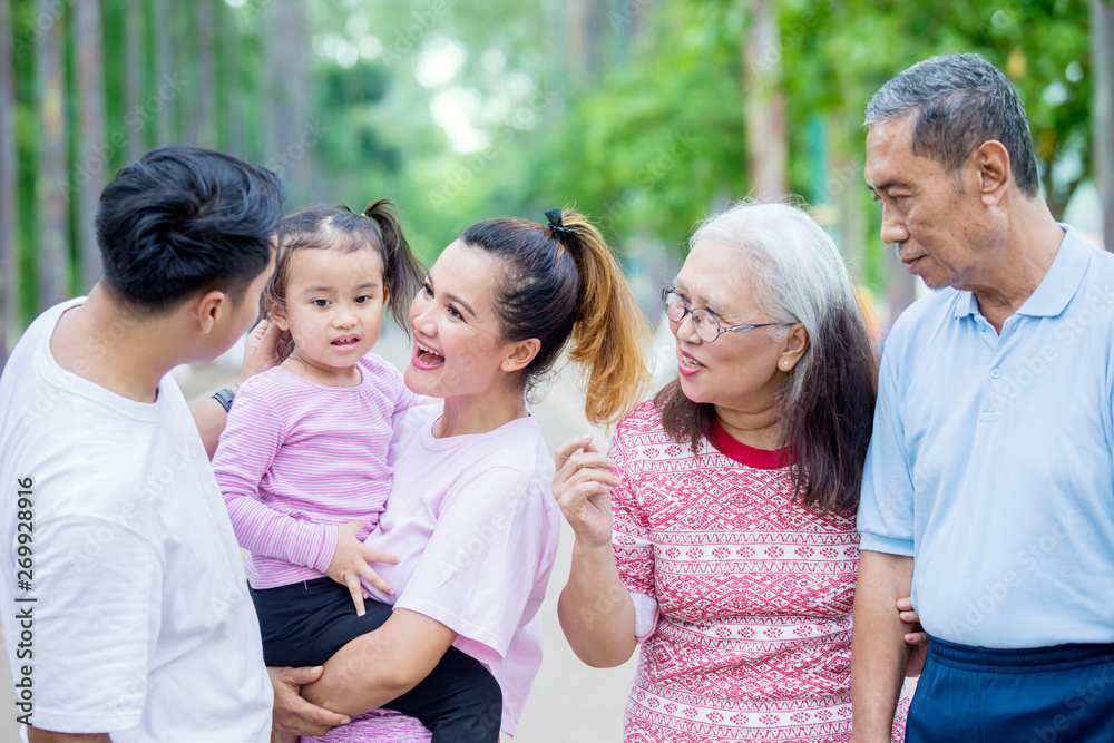 Extended family chatting at outdoors