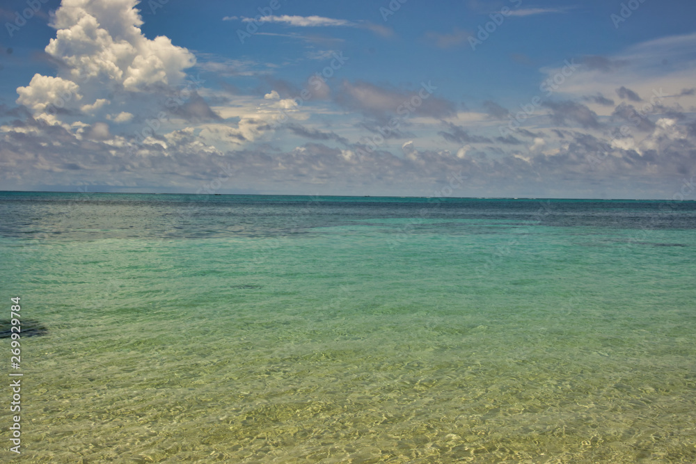 photo of the sea with crystalline water and a beautiful blue sky with clouds photo of the sea with crystalline water and a beautiful blue sky with clouds