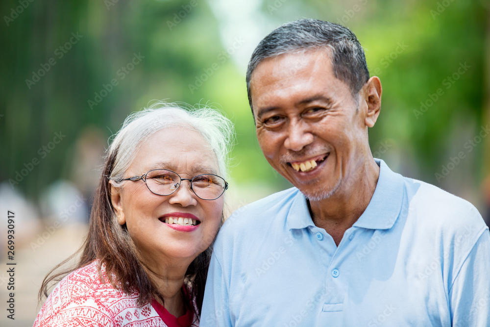 Romantic old couple standing in the park Romantic old couple standing in the park