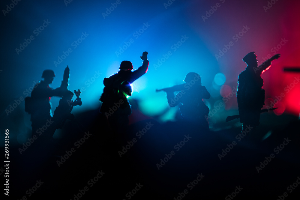 Fototapeta premium War Concept. Military silhouettes fighting scene on war fog sky background,